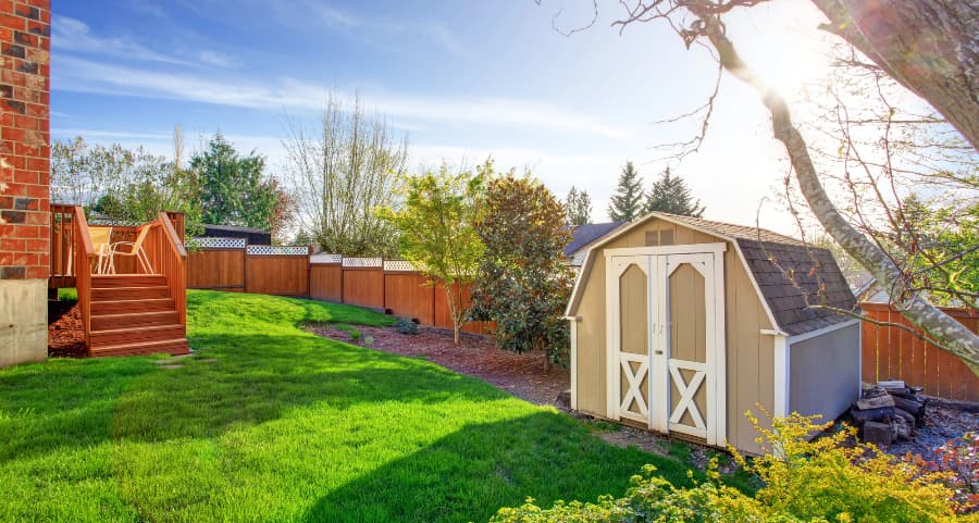 Fenced backyard with storage shed in Louisville